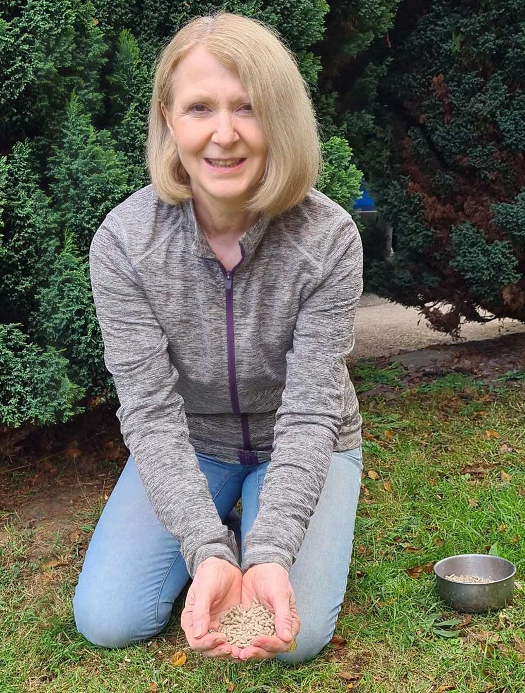 Ingrid Cole has to feed the mystery tame duck by hand at her home in Kemsley, Sittingbourne