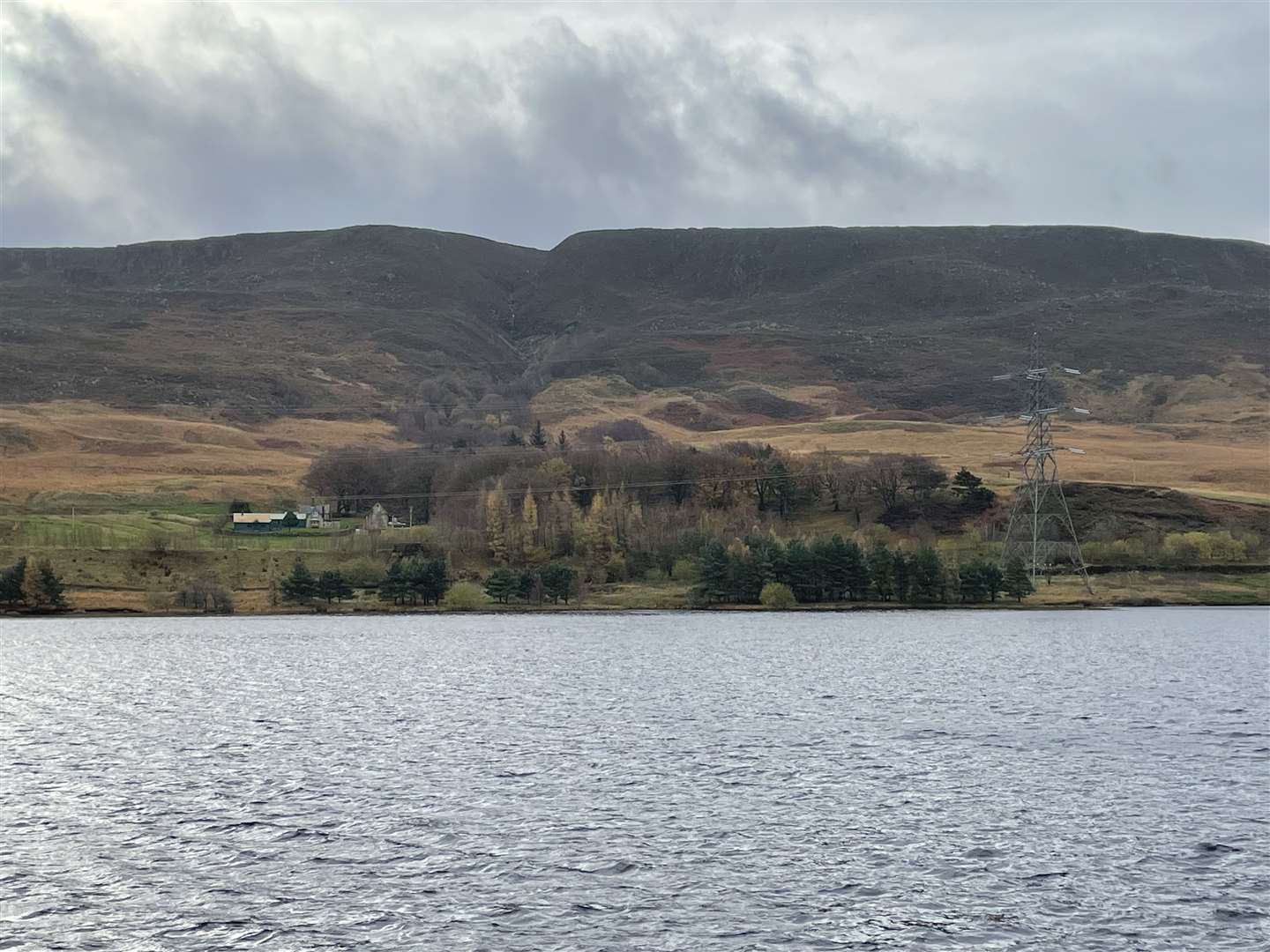 Woodhead Reservoir, in Derbyshire, in August (top) and in November (Dave Higgens/PA)