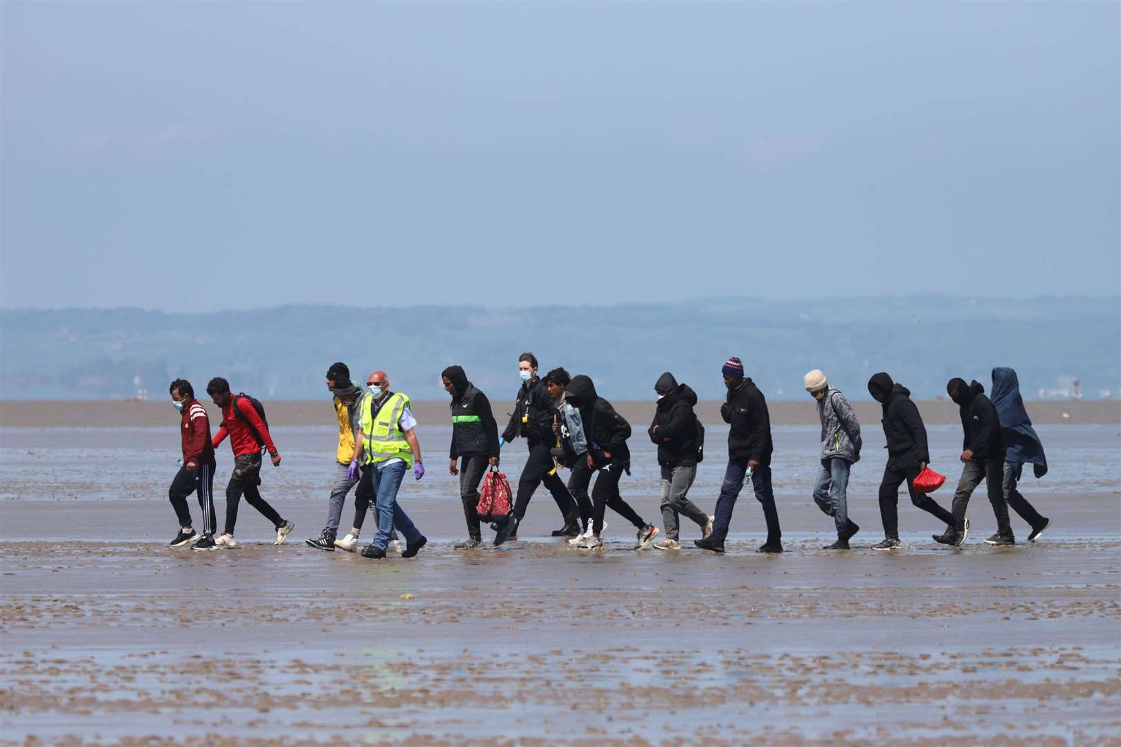 Asylum seekers with officials at Romney Marsh Submitted picture