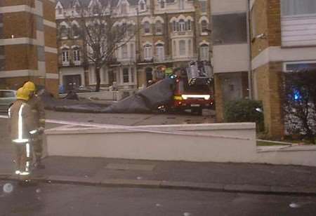 DEVASTATION: The bitumen covered wooden frame crashed on to cars and a fire engine. Picture courtesy of Paul Howlett, DMP Roofing