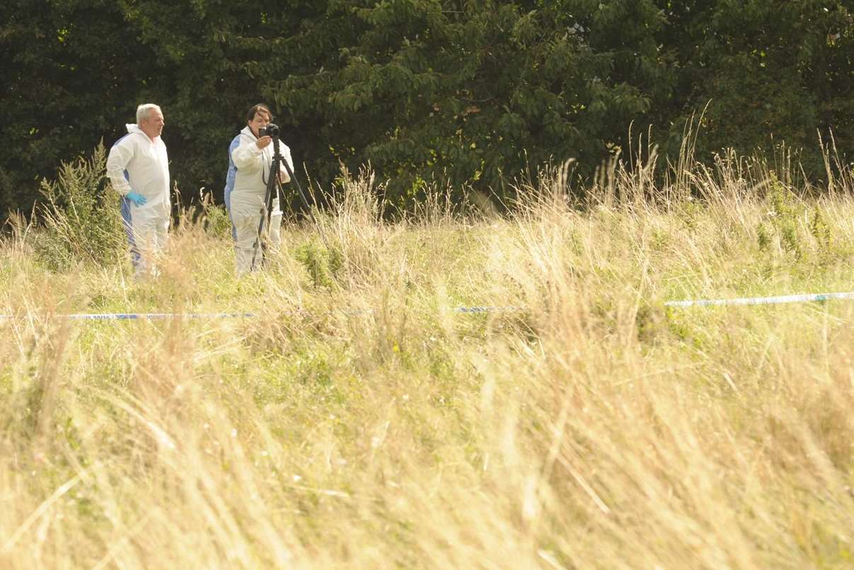 Forensics officers work at the scene were a man was stabbed. Picture: Steve Crispe