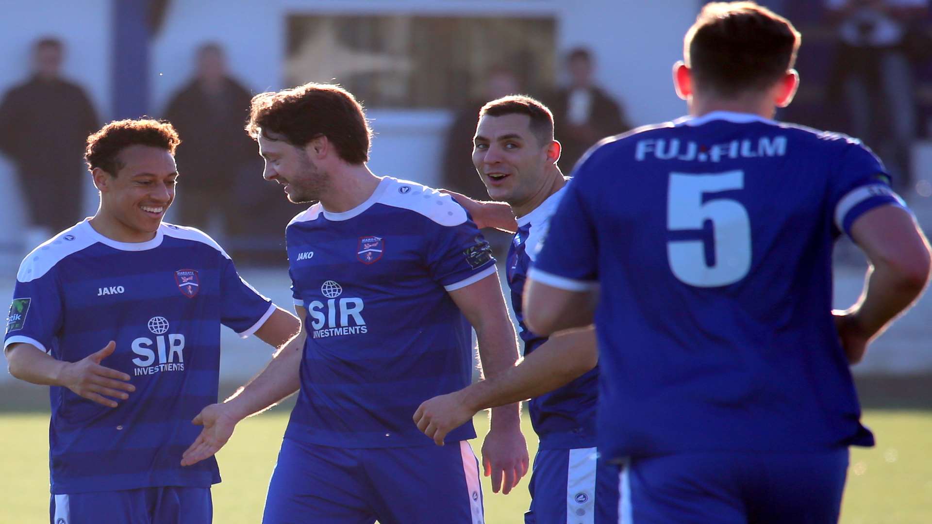 Frannie Collin, second left, is congratulated by team-mates after his stunning free-kick against Burgess Hill Picture: Don Walker