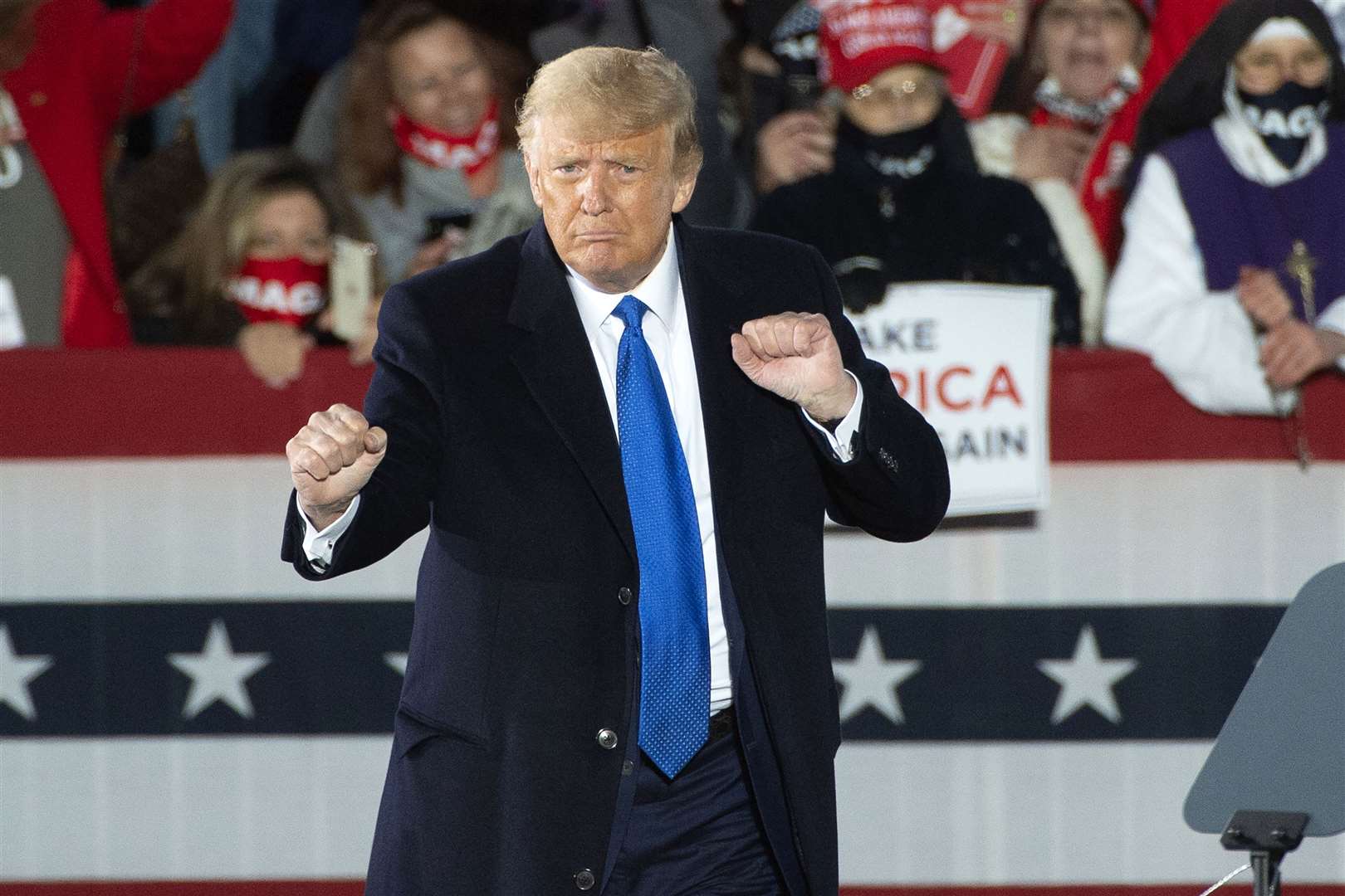 Donald Trump does a little dance during a campaign rally in Ohio (Phil Long/AP)