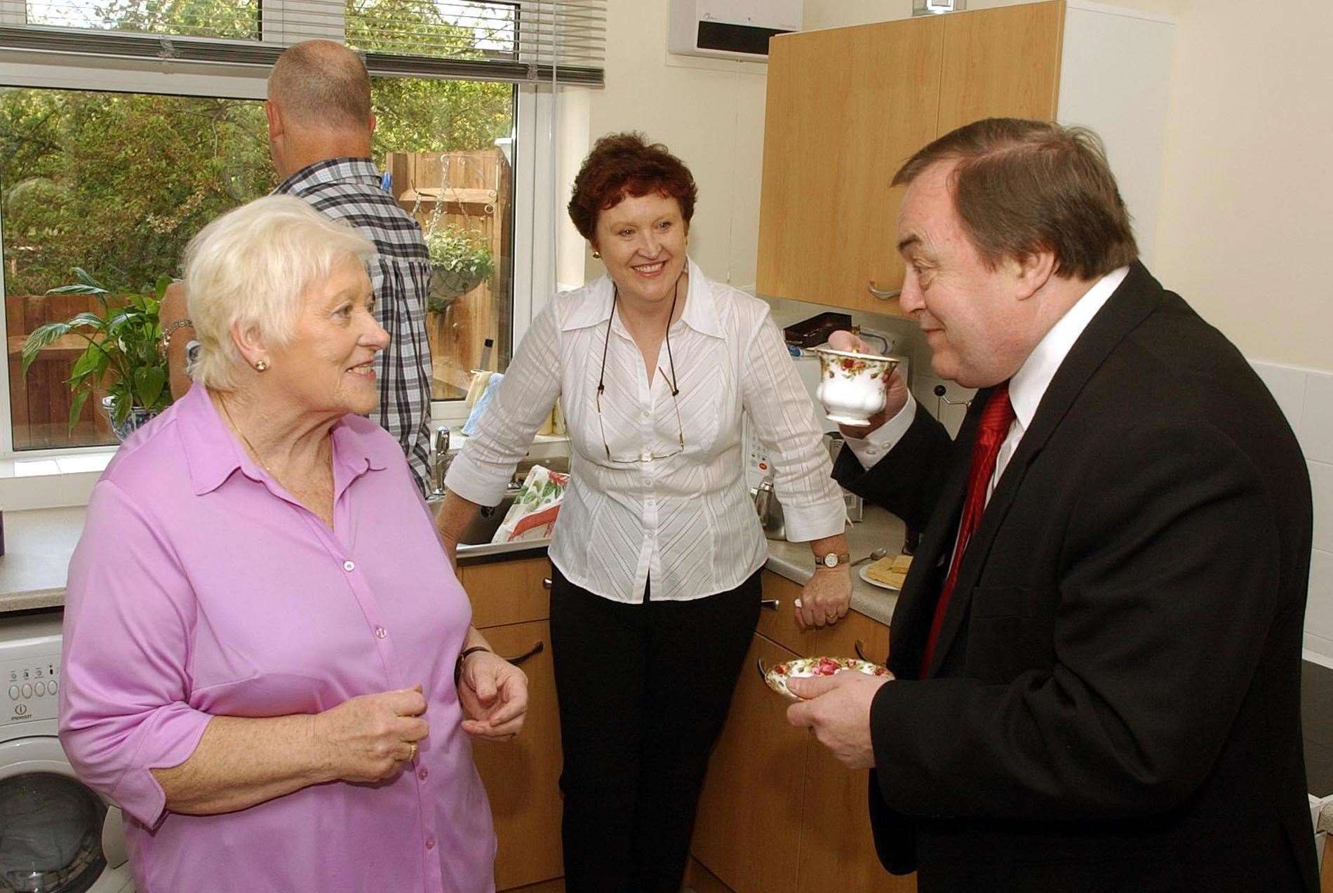 John Prescott enjoying a cup of tea as part a visit to promote the Government’s Decent Homes programme in 2004 (John Stillwell/PA)