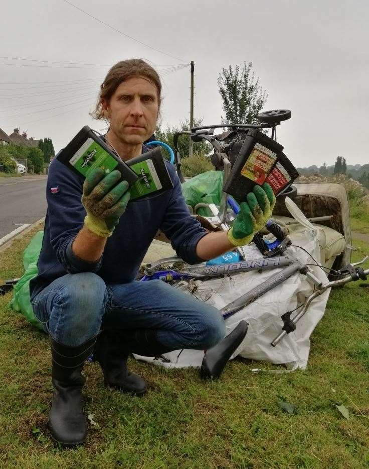 Tony Harwood with some of the sharps boxes and other rubbish collected