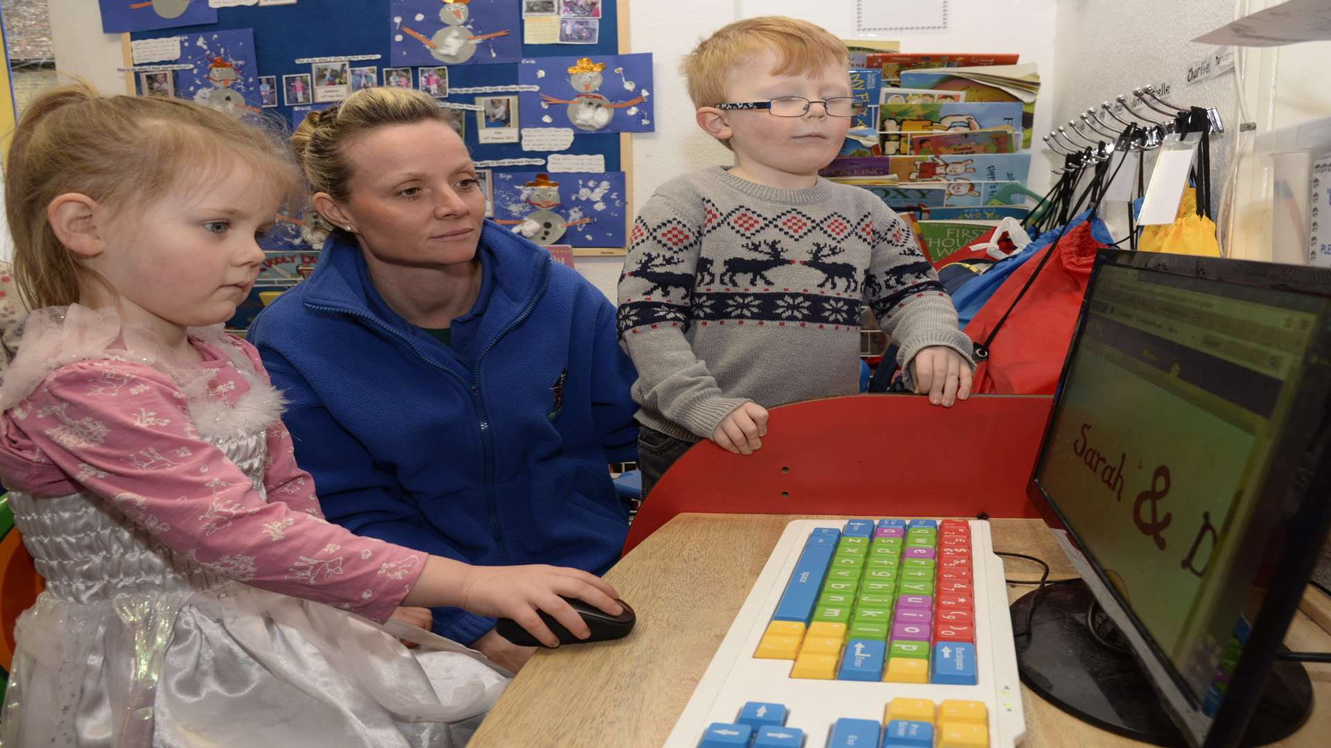 Mia Quincy, four, and Callum McCluskey, three, at work with Lissa Hairsine