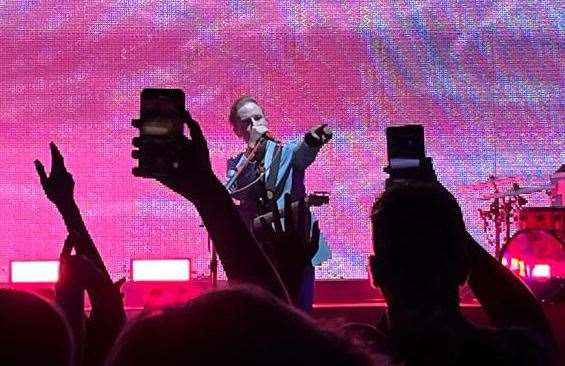 Two Door Cinema Club frontman Alex Trimble - framed by cameraphones