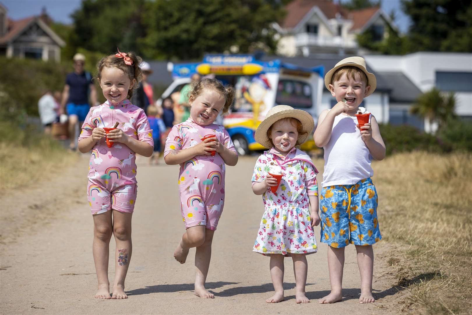 Twins Bella and Layla Hughes with Annie Shepherd and her brother Jude Shepherd at Helen’s Bay beach in County Down (Liam McBurney/PA)