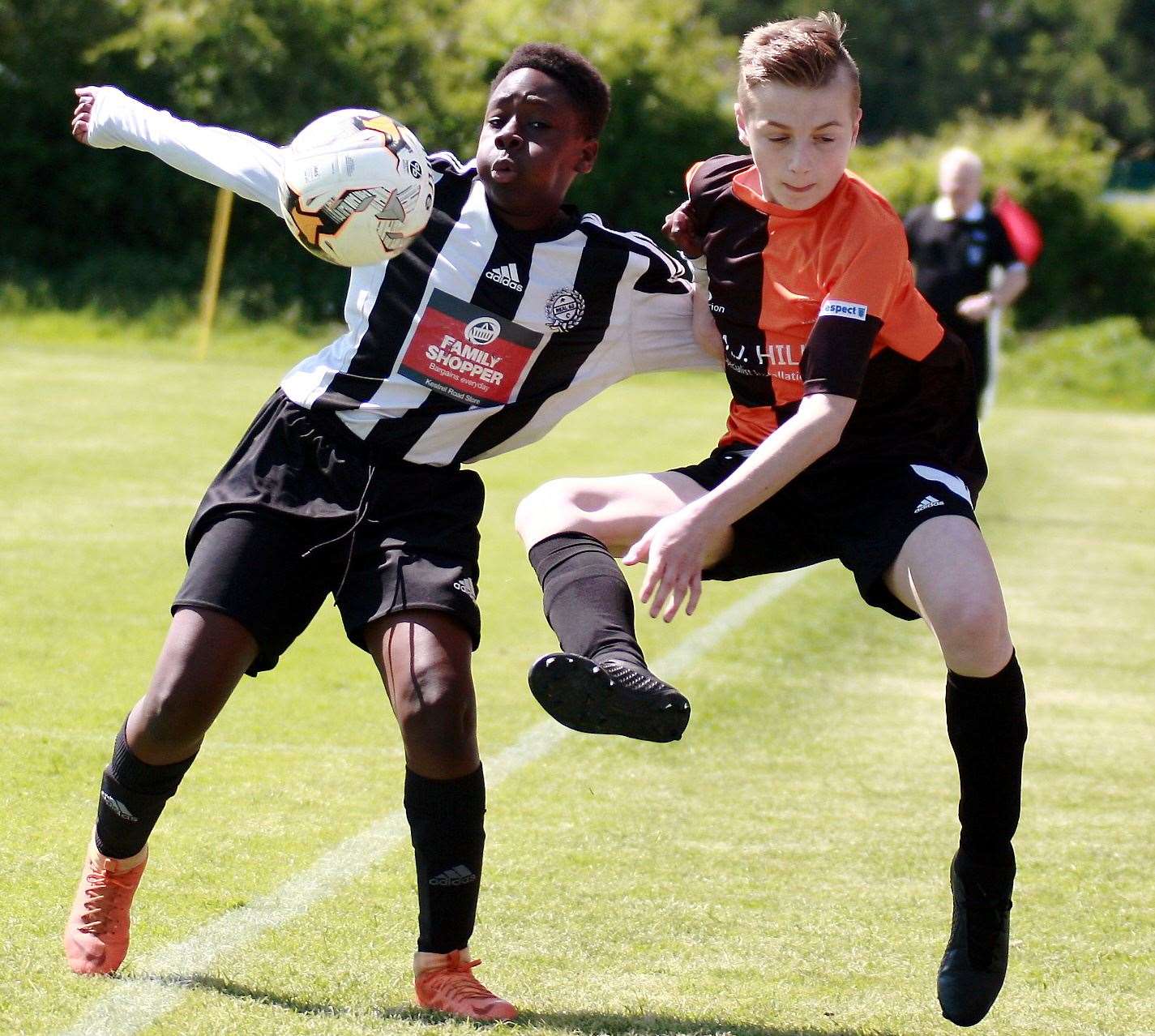 Pegasus 81 under-14s (orange) take on Real 60 Tigers under-14s in the League Cup final. Picture: Phil Lee FM10148961