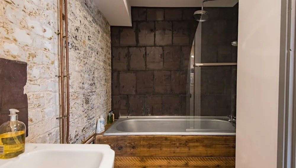 The Welsh slate came from a roof and the steel bathroom was found in a nearby tip. Picture: Unique Property Company