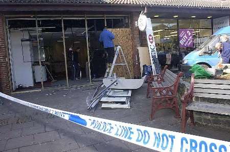 Workmen repairing the damage to the bank. Picture: BARRY CRAYFORD