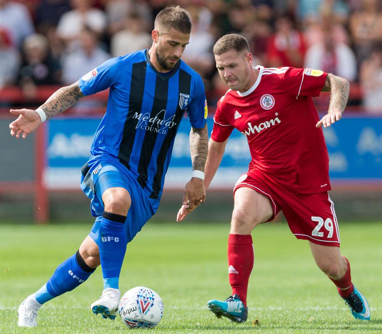 Gillingham's Max Ehmer challenges with Accrington's Billy Kee. Picture: Ady Kerry