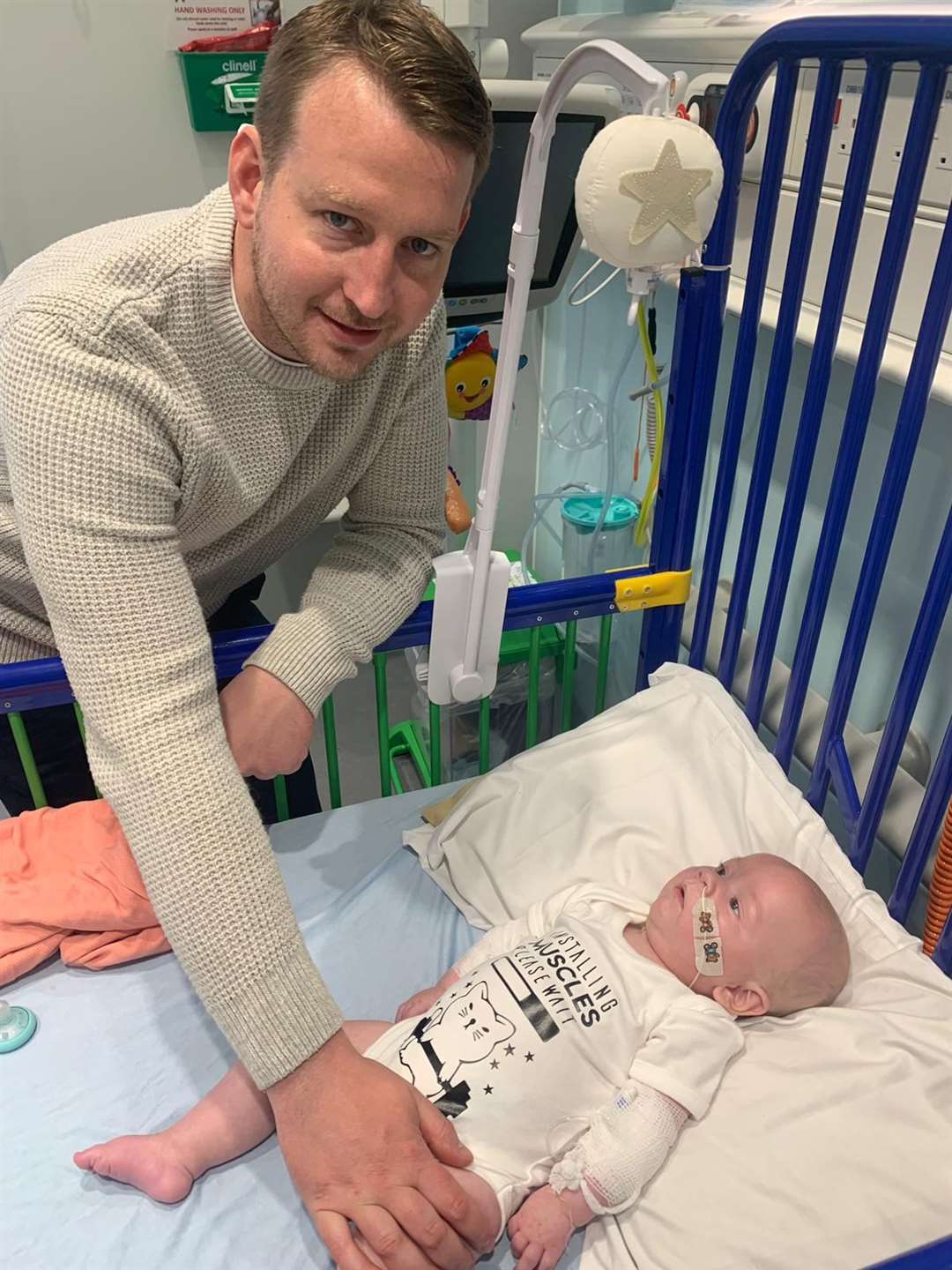 Five-month old Arthur Morgan with his father Reece Morgan (NHS England/PA)