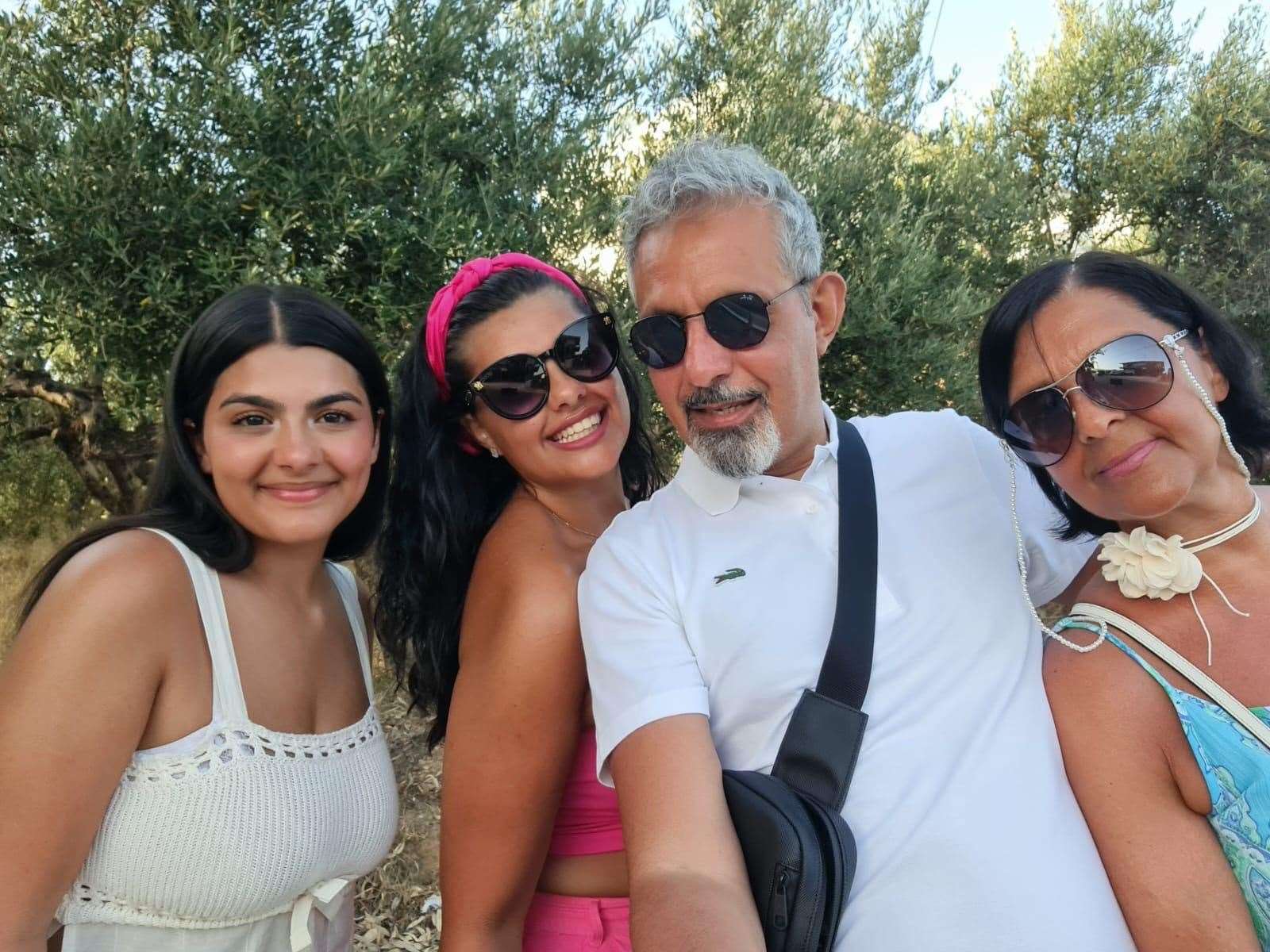 Natassa (far left) with older sister Sofia and their parents Adam and Tina (Sofia Adamou/PA)