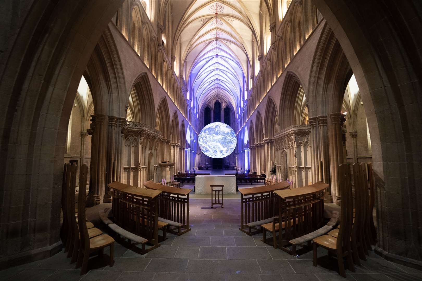 Gaia, Luke Jerram’s seven-metre-wide replica of the earth, created using detailed NASA imagery of the Earth’s surface, pictured suspended in Wells Cathedral, Somerset (James Manning/PA)