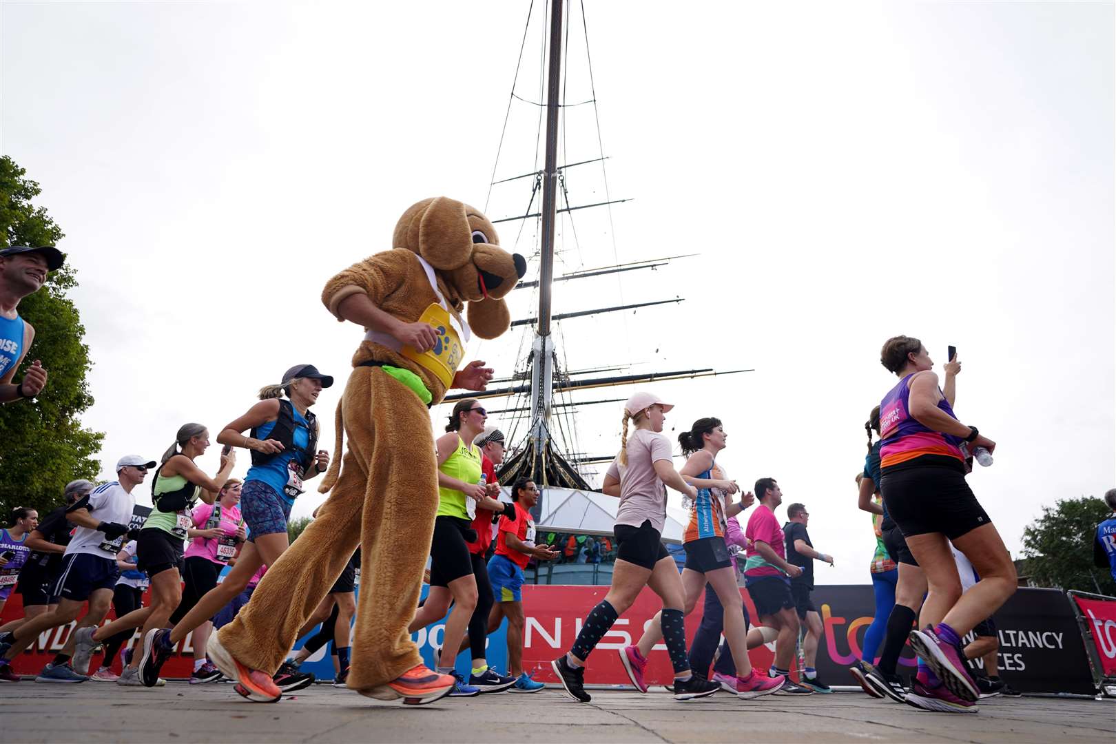 One person runs in a dog onesie at the London Marathon (James Manning/PA)