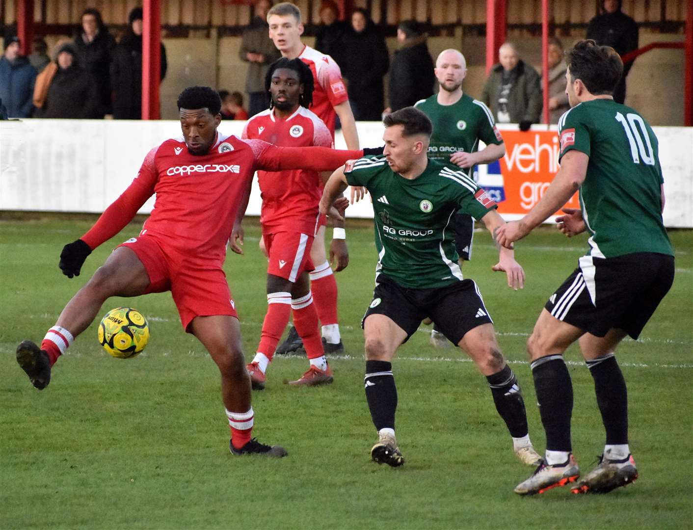 Vance Bola takes control of the situation during Hythe’s home game against Burgess Hill. Picture: Randolph File