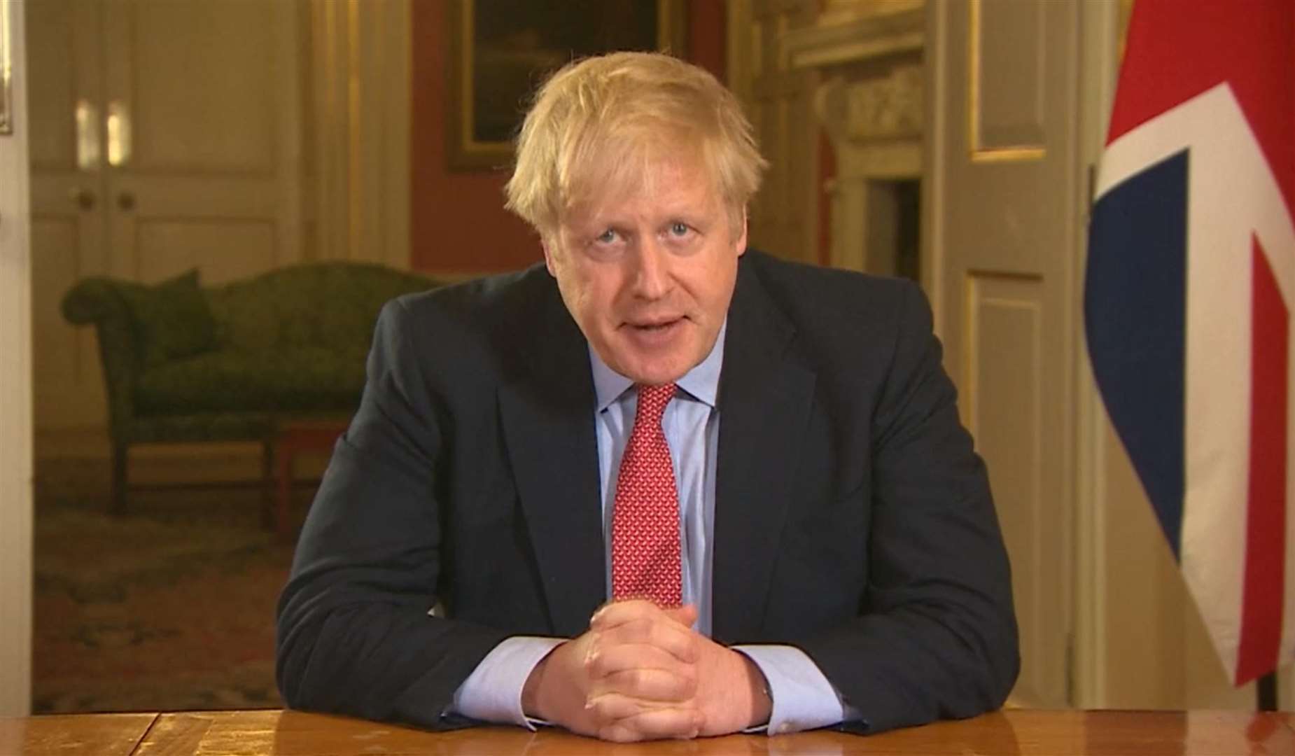 Prime Minister Boris Johnson addressing the nation from 10 Downing Street (PA)