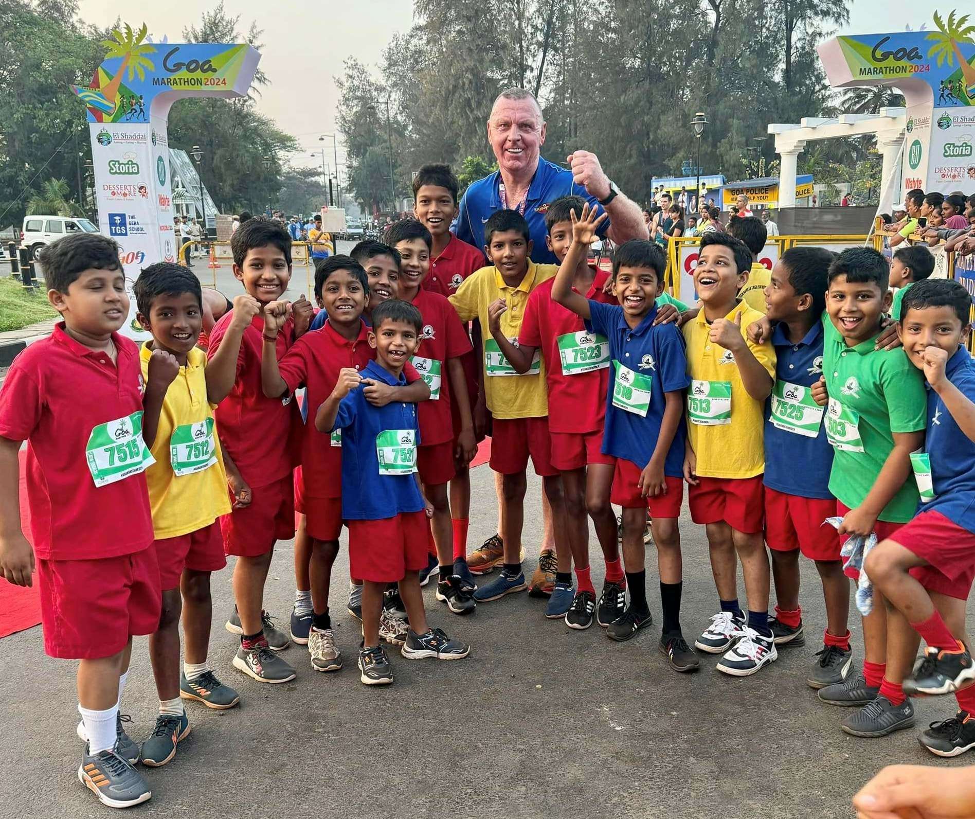 John McCormack with young runners at the start of last year's charity 10k in Goa