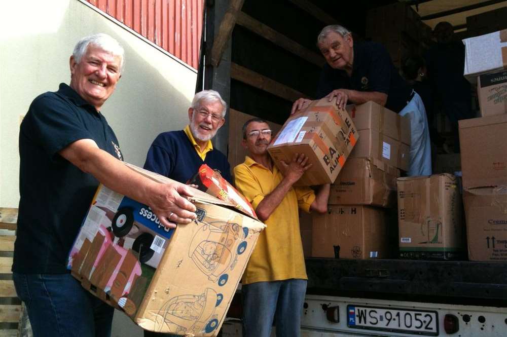 Swale Lions members, Mike Parker, Chris Isles, Barry Sprason and John Torr loading boxes at The Gateway which are bound for Belarus