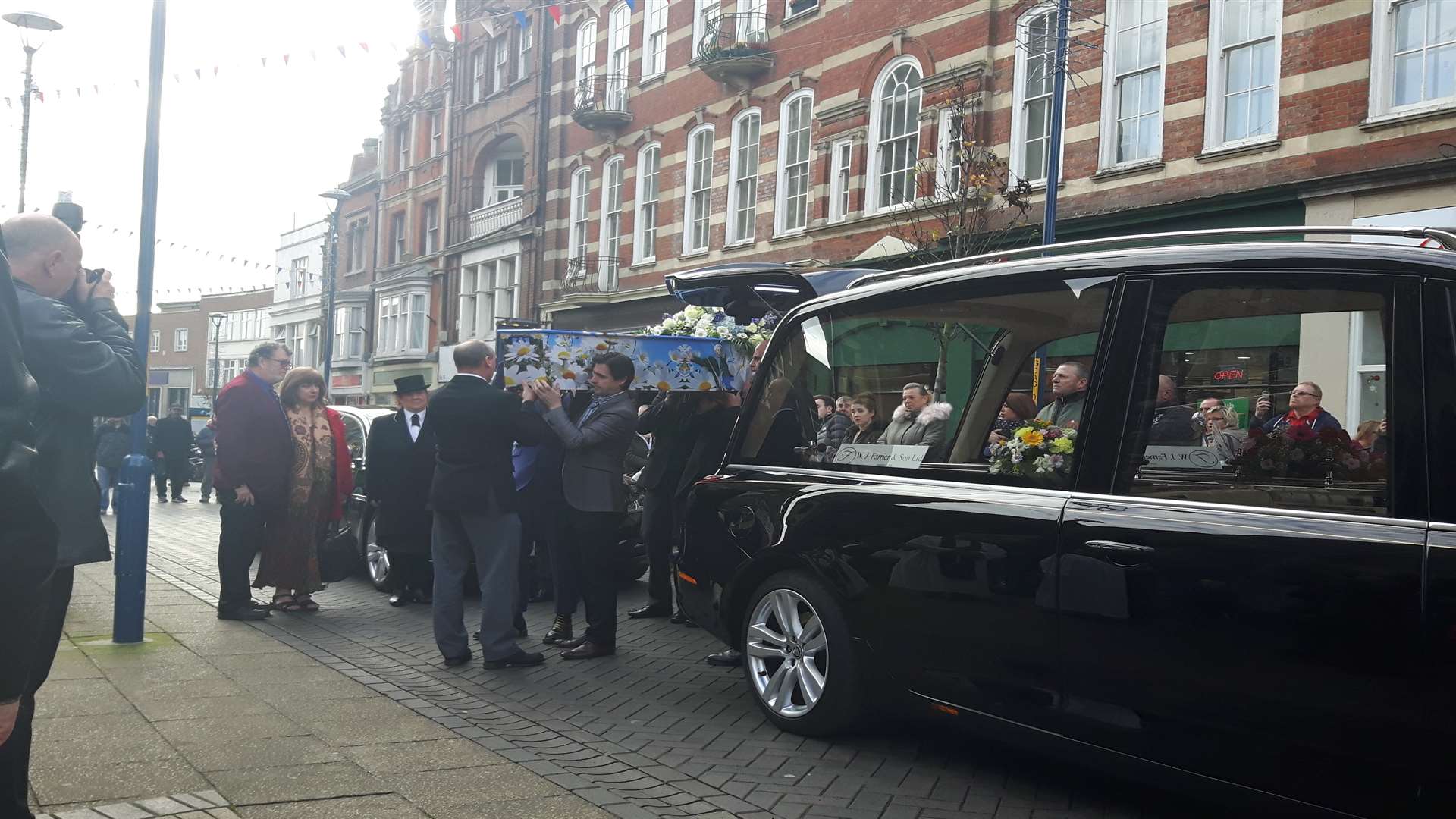 Pallbearers take Kelly Turner's coffin in to St Mary the Virgin Church for her funeral