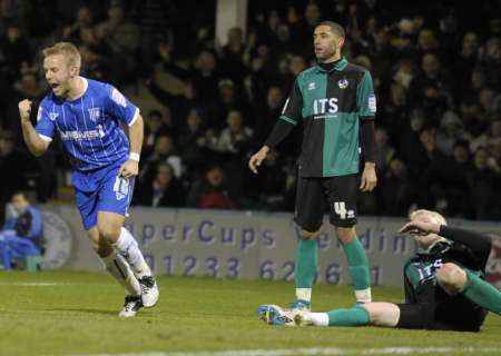 Danny Jackman celebrates after scoring Gillingham's third goal