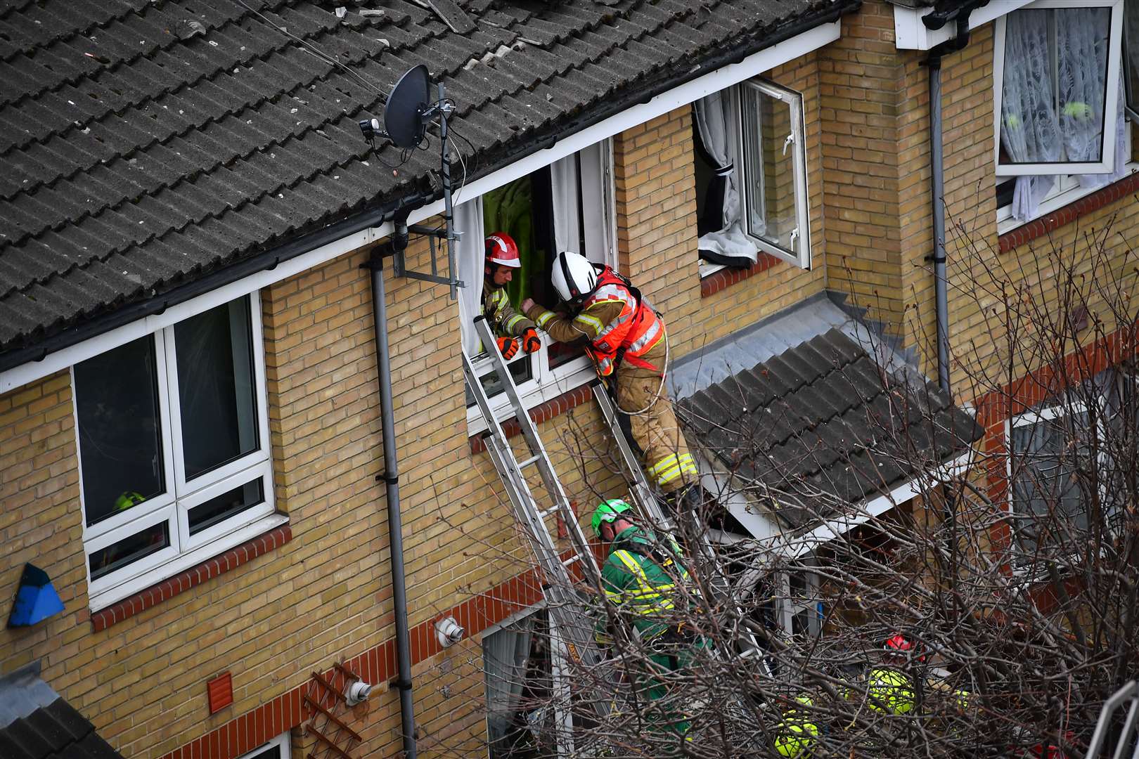 Emergency personnel at the scene in Bow (Victoria Jones/PA)