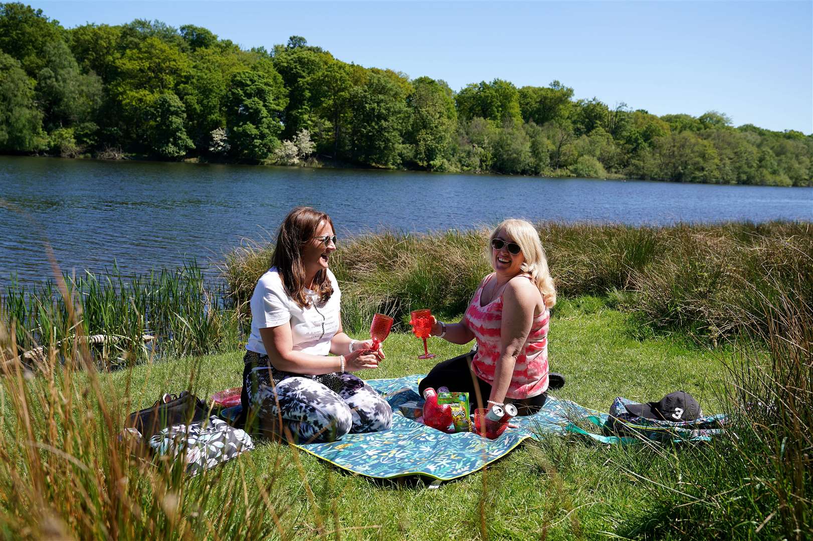 People enjoy a picnic in Tatton Park, Knutsford, Cheshire (Martin Rickett/PA)