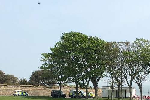 Police and the coastguard have been spotted over West Cliff. Picture: @SirDaveLambert