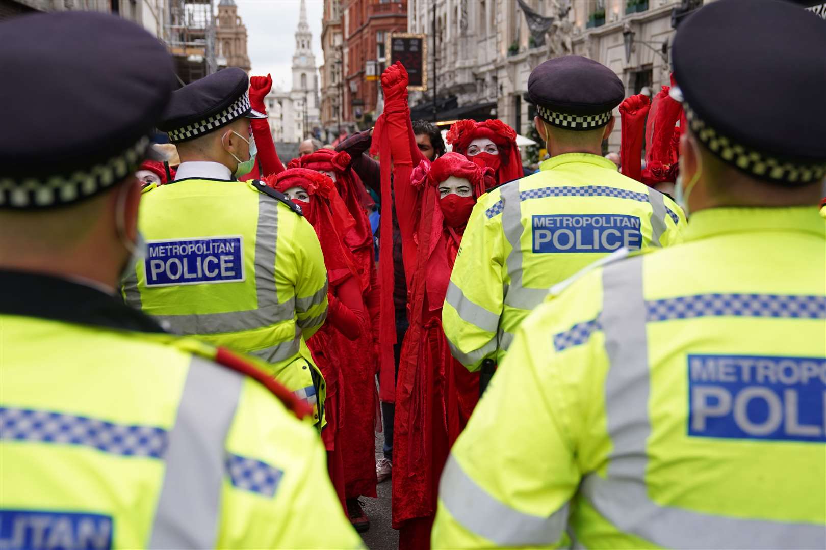 Red Rebels gather during a protest by members of Extinction Rebellion on St Martin’s Lane, central London (Stefan Rousseau/PA)