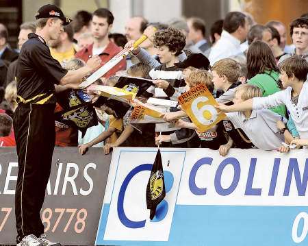 Joe Denly signs autographs for young fans