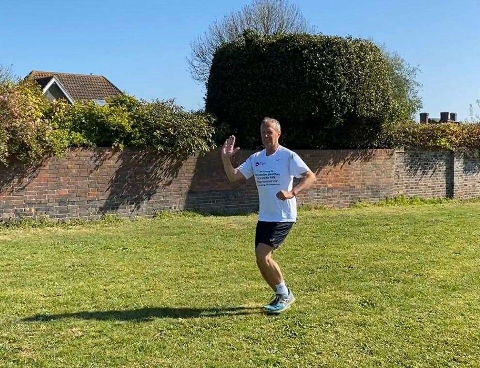 Ray Johnson runs backwards along The Leas in Folkestone for his 2.6 challenge