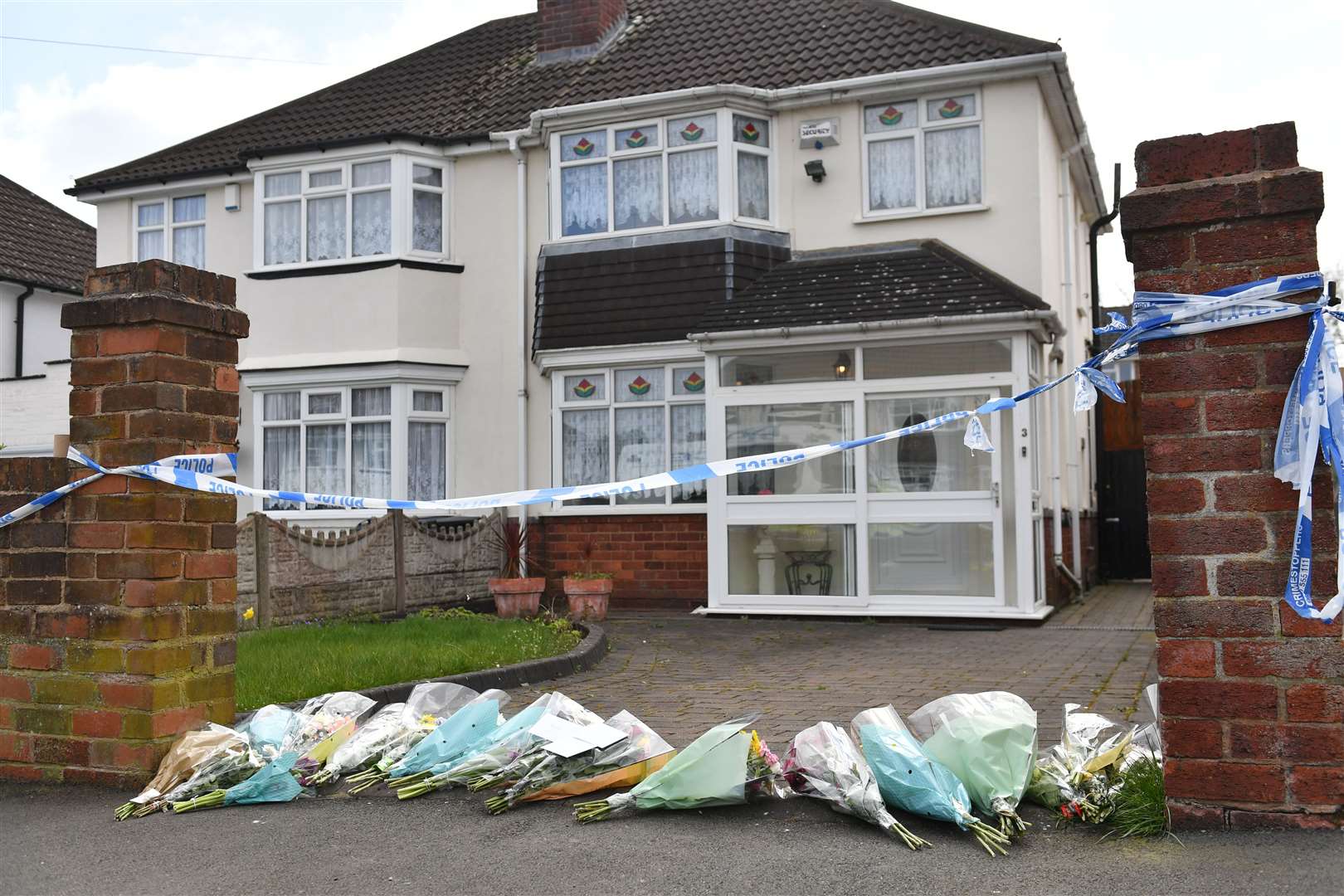 Flowers outside the house on Boundary Avenue in Rowley Regis (Jacob King/PA)