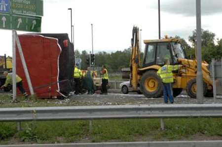 Some of the paper on the road had to be swept up by hand. Picture: GRANT FALVEY