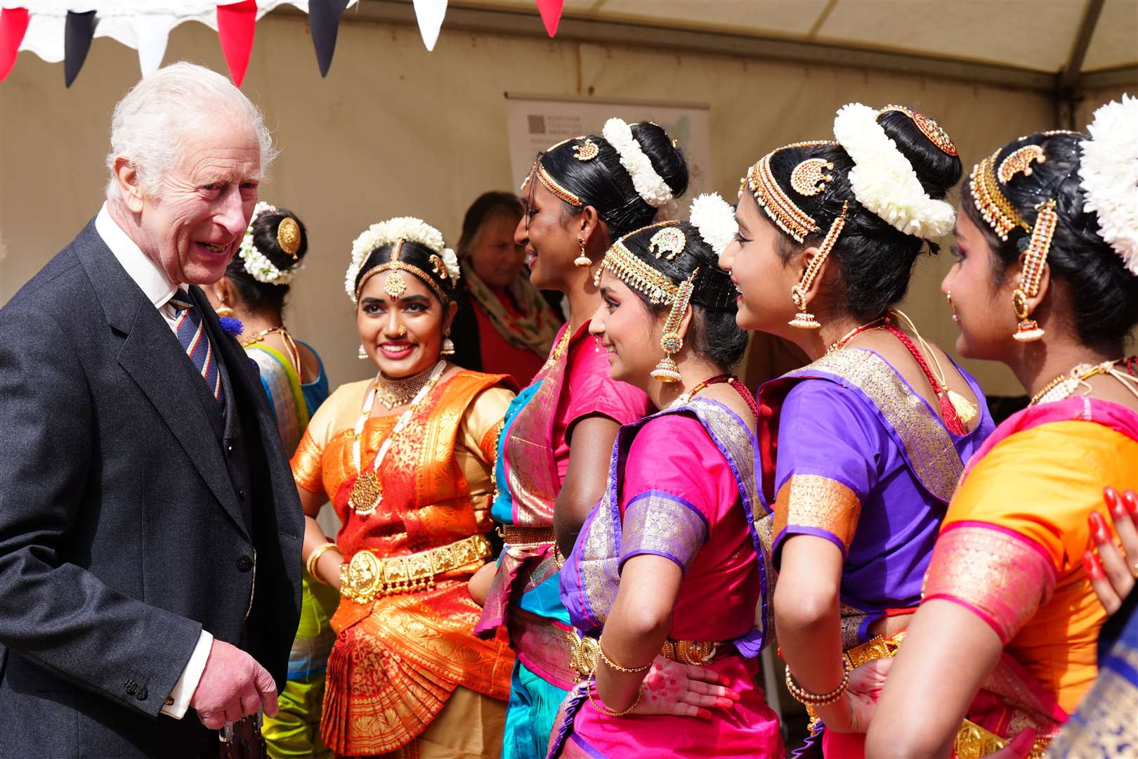 The King meets performers at a celebration at Edinburgh Castle to mark the 900th anniversary of the city at the start of July (Jane Barlow/PA)