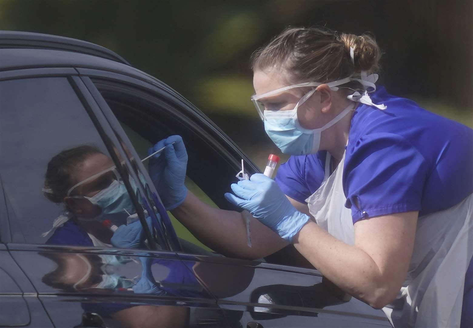 An NHS worker being tested for coronavirus at a temporary testing station in the car park of Chessington World of Adventures (Aaron Chown/PA)