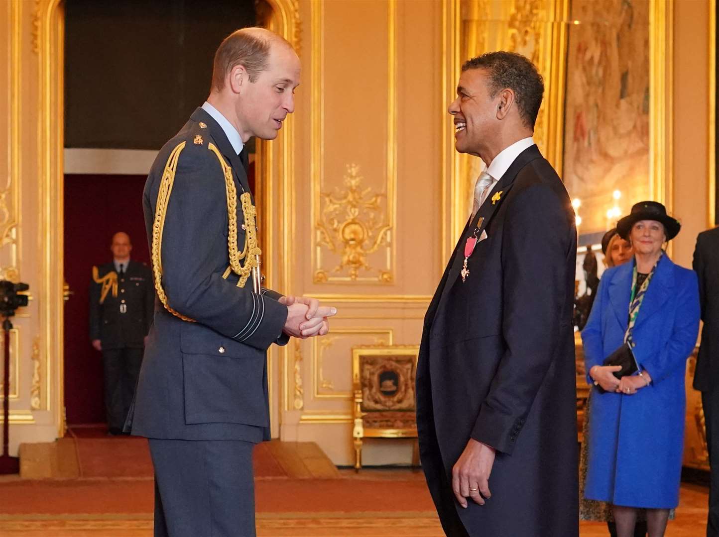 The Prince of Wales invests former footballer Chris Kamara as a Member of the Order of the British Empire at Windsor Castle in March (Jonathan Brady/PA)