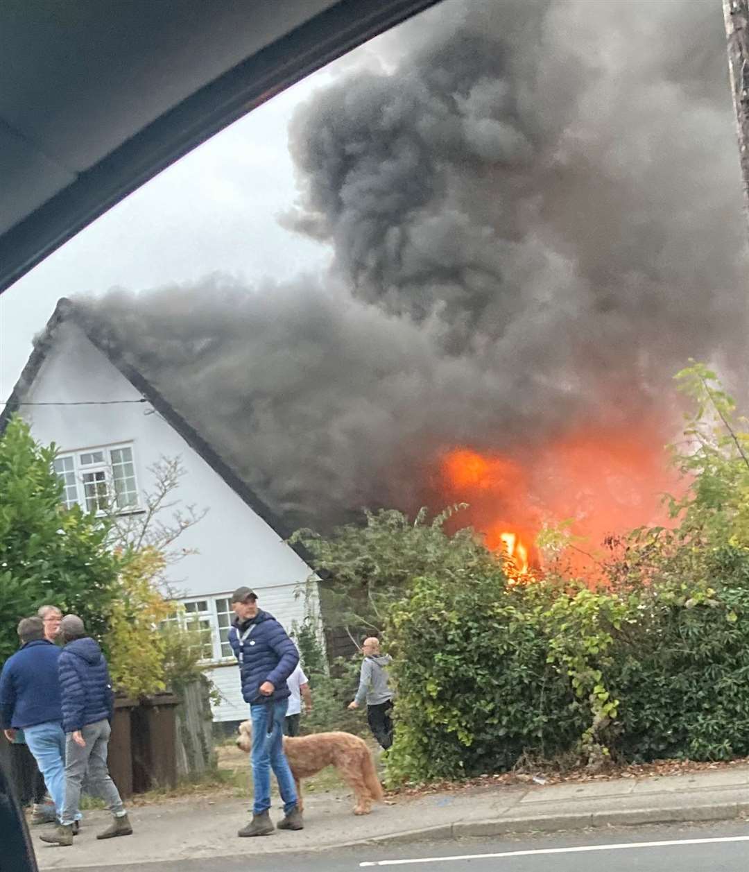 The home in West Malling ablaze. Photo courtesy of Phil Sellick.