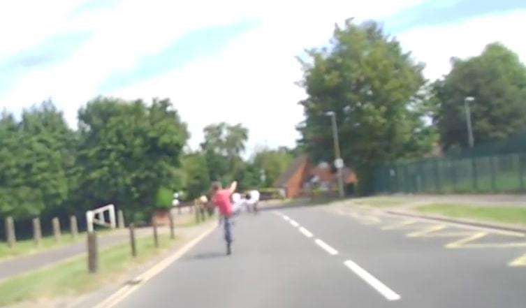 One boy attempts to balance on one leg whilst doing a wheelie (5019767)