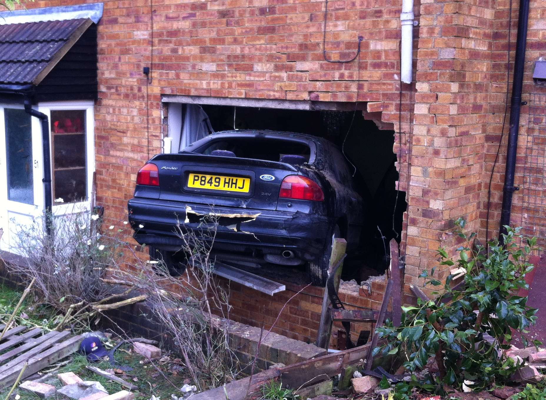 A driver of a Ford car has smashed into the front of a house in ...