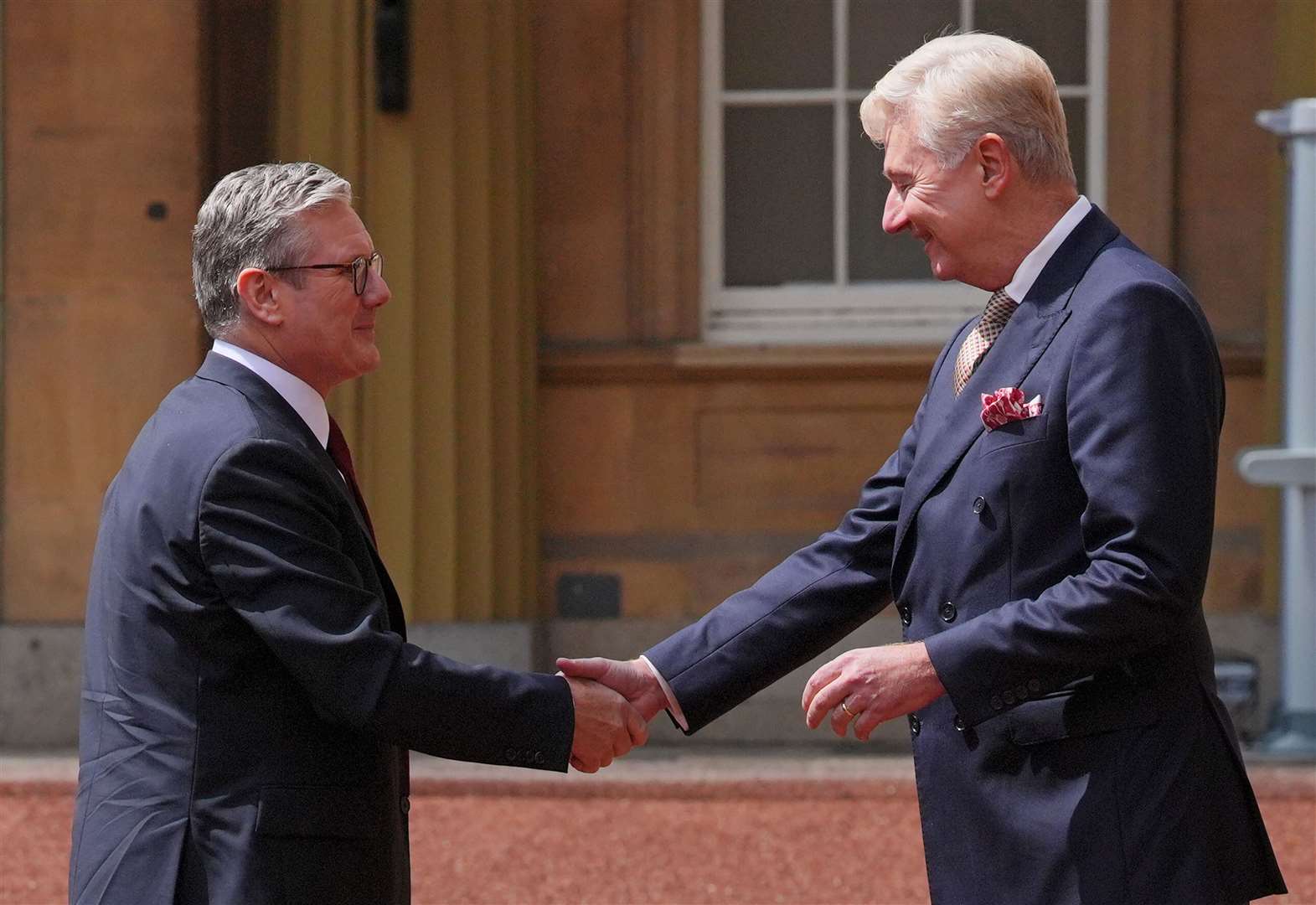 Sir Clive Alderton, Principal Private Secretary to the King and Queen, welcomed Sir Keir Starmer to Buckingham Palace (Jonathan Brady/PA)