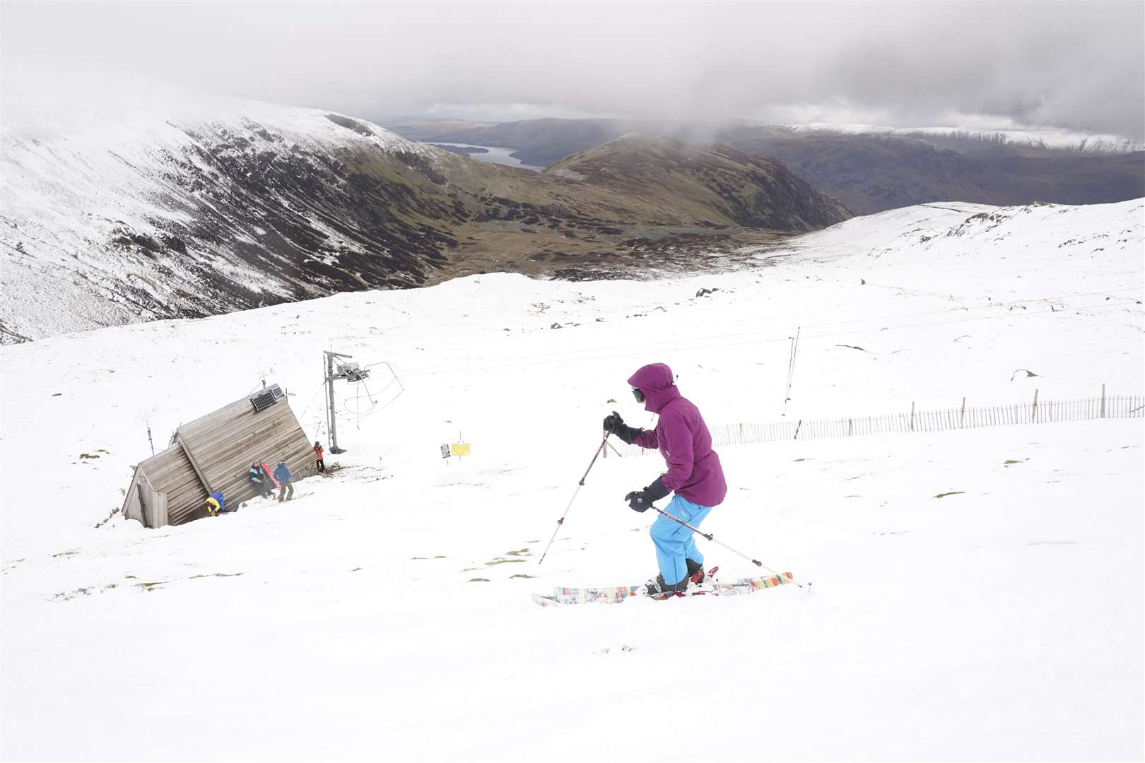 A skier makes their way down the slope at the Lake District Ski Club (Owen Humphreys/PA)