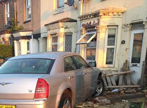 Car crashes into house