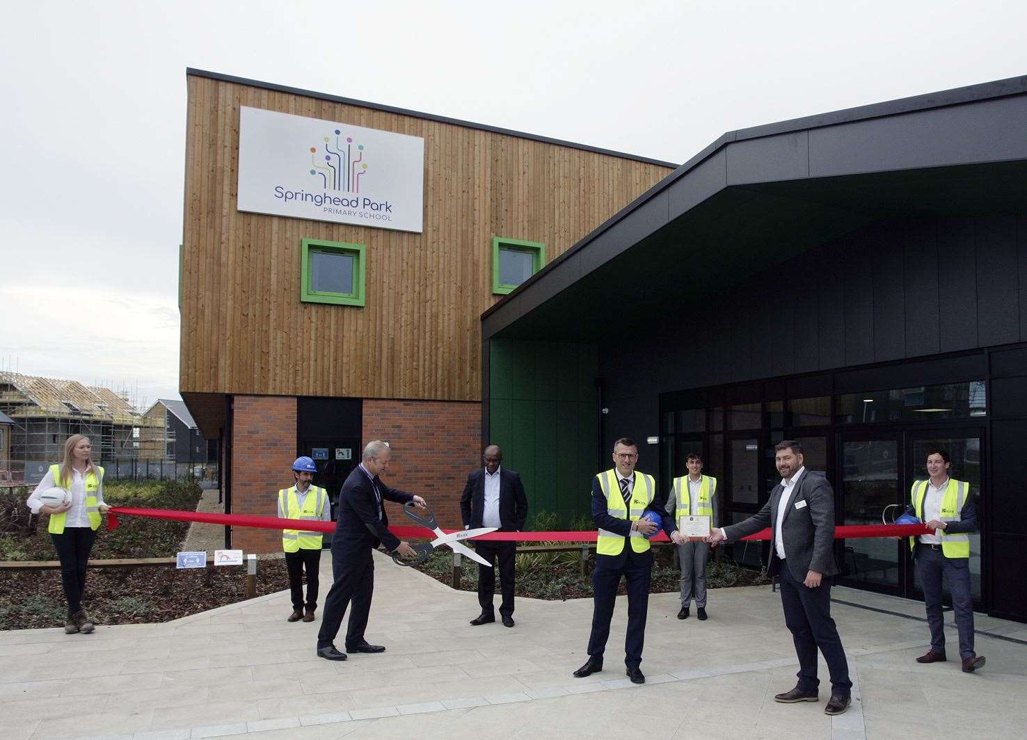 Contractors Kier and principal Wayne Clayton cut the ribbon at the grand opening of Springhead Primary School