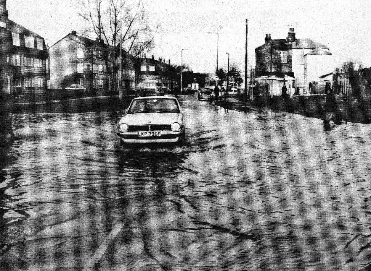 A car aquaplanes in Granville Road when the sea flooded Sheerness in January 1978. KM Photographer.