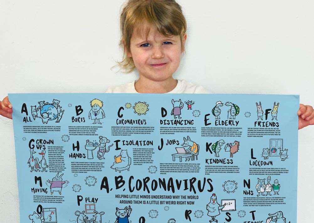 Willow, 3, with the poster her parents have designed