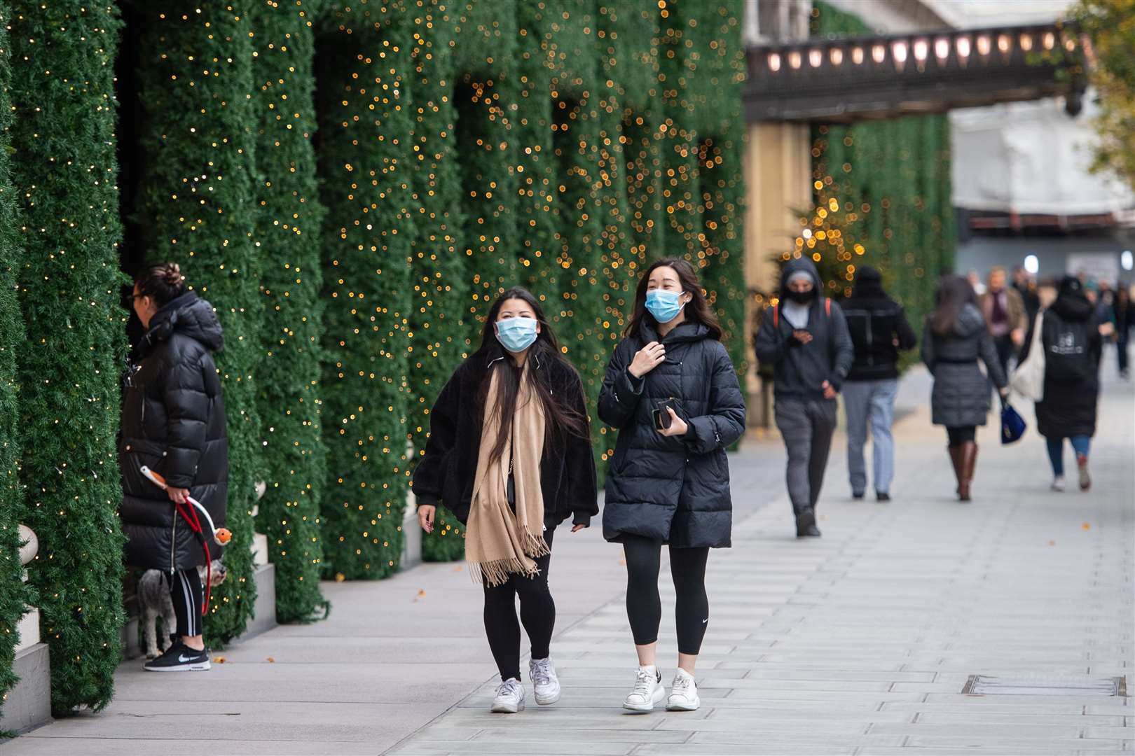 People wearing face masks on Oxford Street, London (Dominic Lipinski/PA)