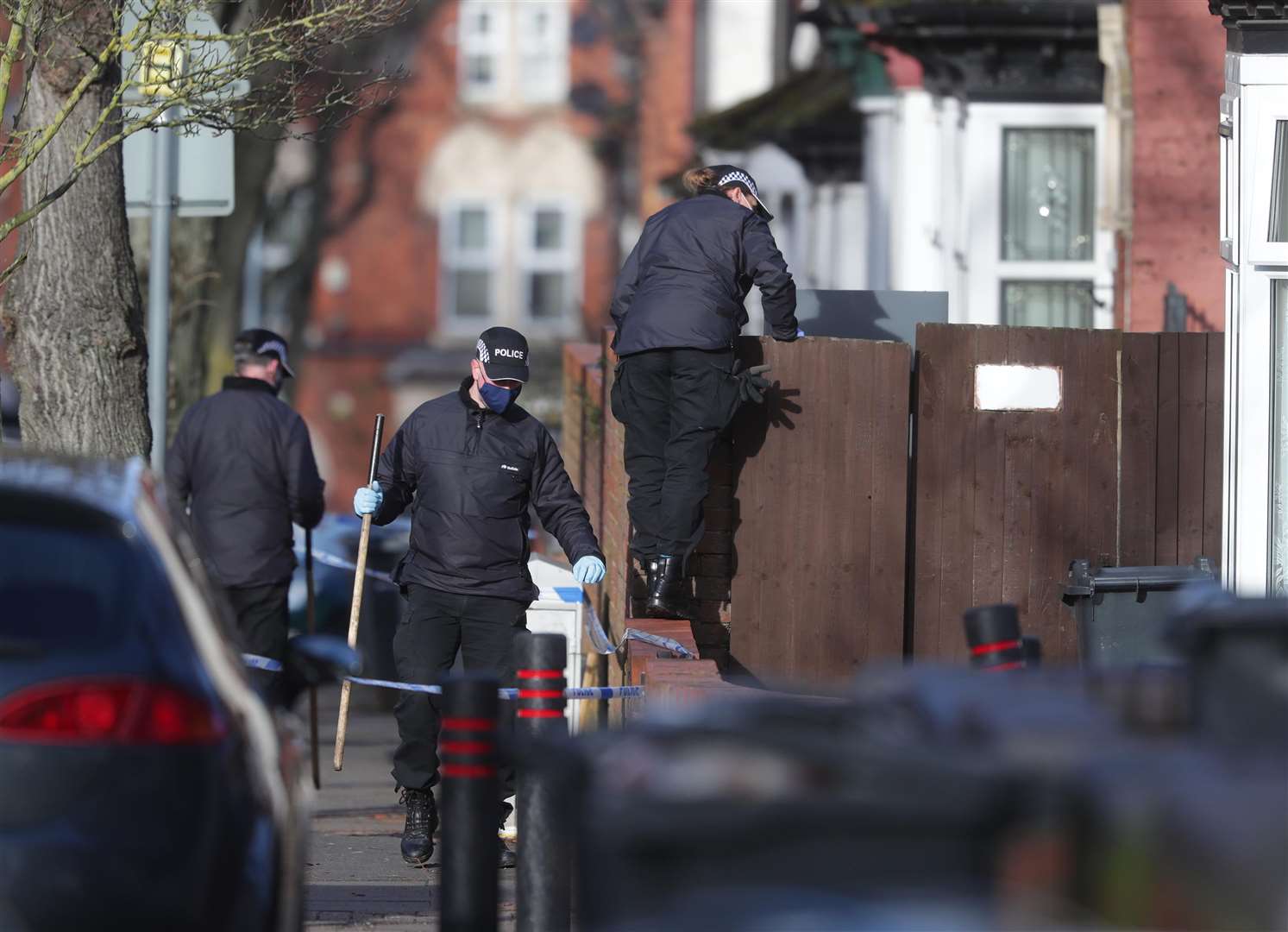 Police officers searching the scene last Friday (David Davies/PA)