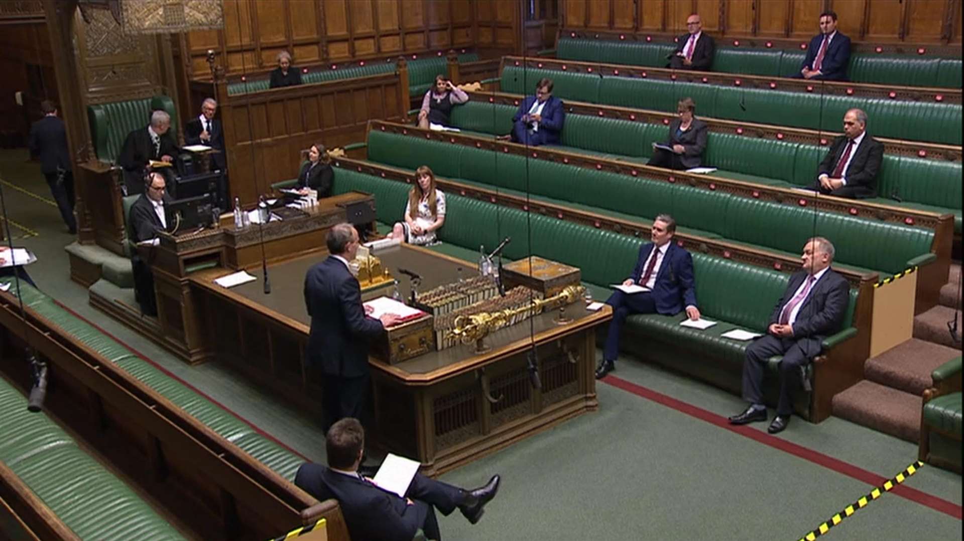 MPs social distancing as Foreign Secretary Dominic Raab speaks during Prime Minister’s Questions (House of Commons/PA)