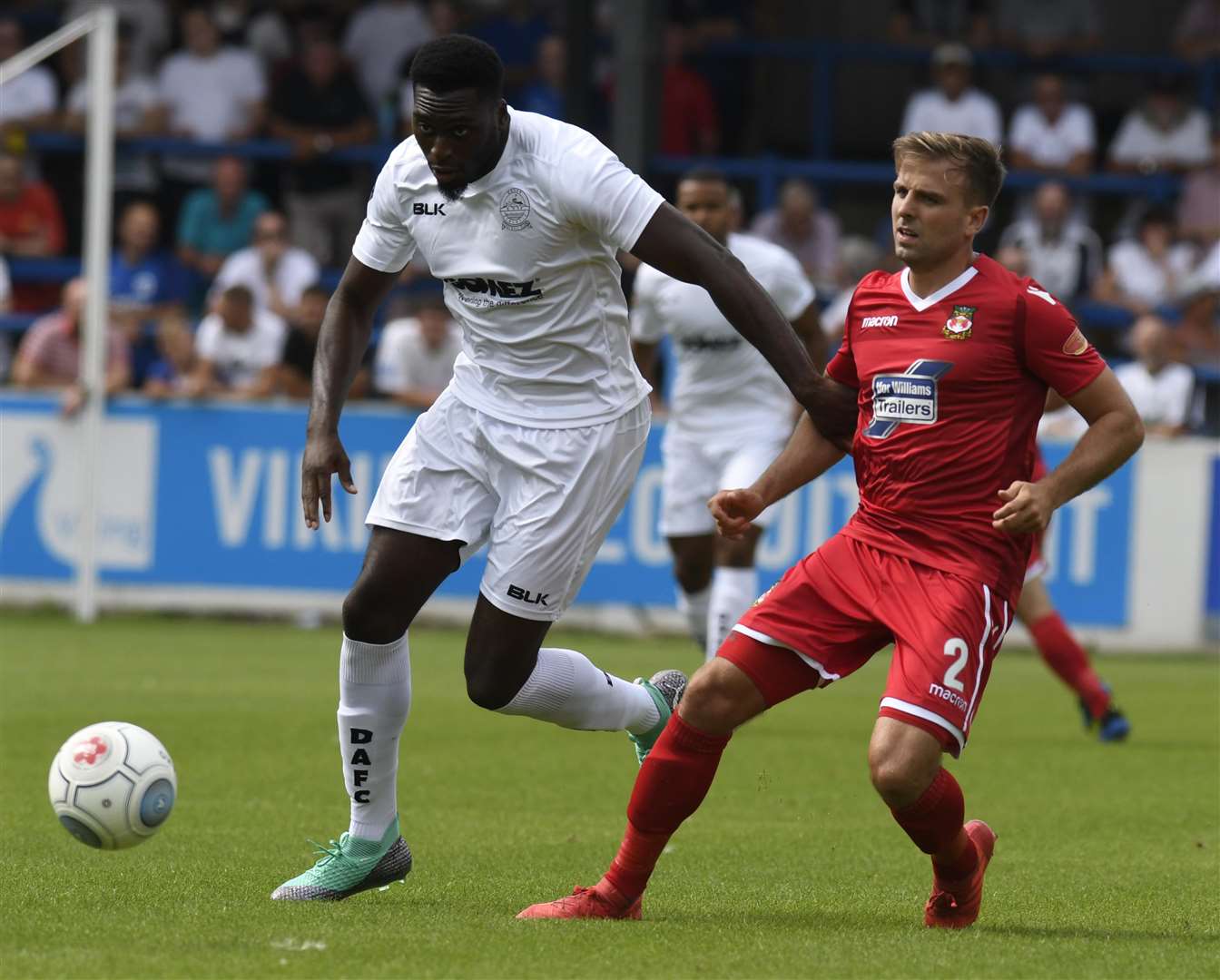 Dover's Inih Effiong holds off Wrexham defender Kevin Roberts Picture: Tony Flashman